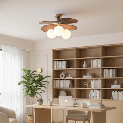 Home office with built-in shelves and a ceiling light with wooden blades.