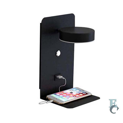 Black wall-mounted charging station with a smartphone on a white background