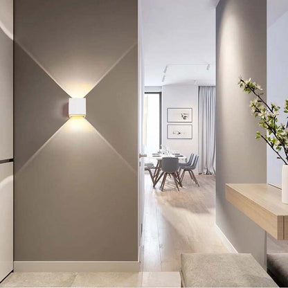 Modern interior design of a hallway with a light fixture and view into a dining area.