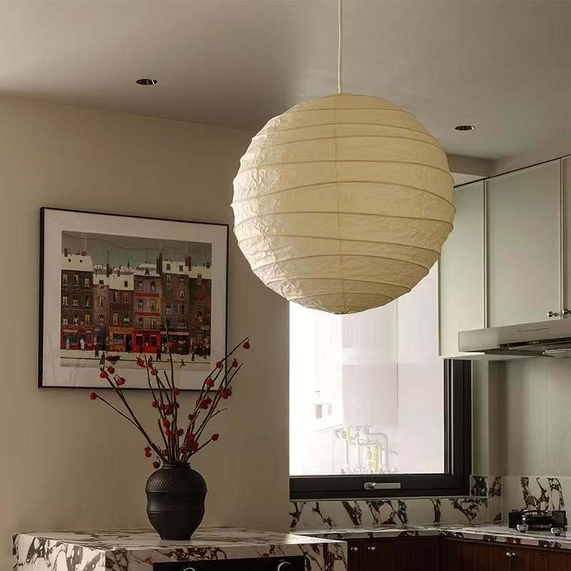 Large paper pendant lamp hanging in a modern kitchen