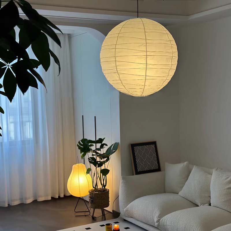 Large paper pendant lamp in a modern living room.