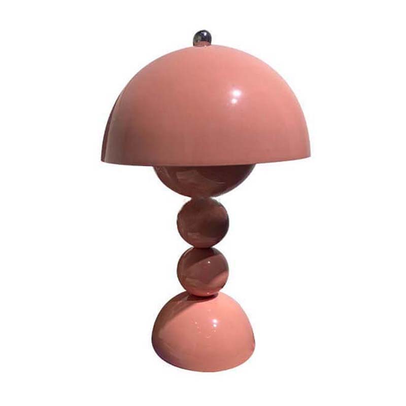 Pink table lamp with a unique design on a white background