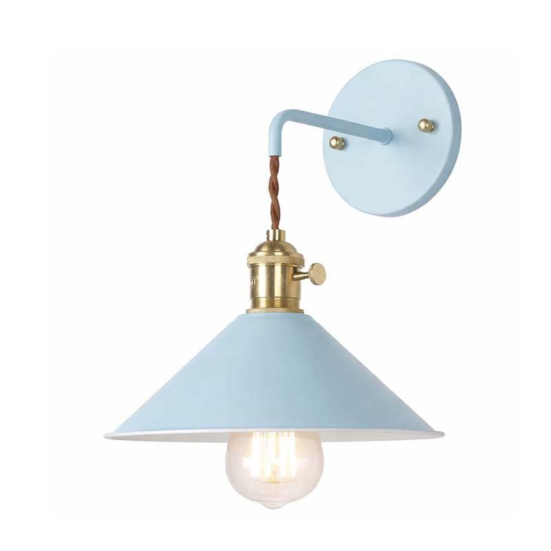 Light blue wall lamp with brass fixture on a white background