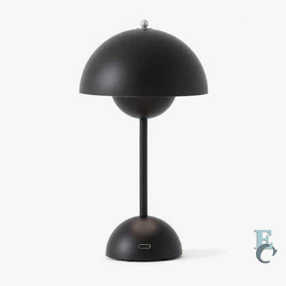 Black table lamp with a unique design on a white background