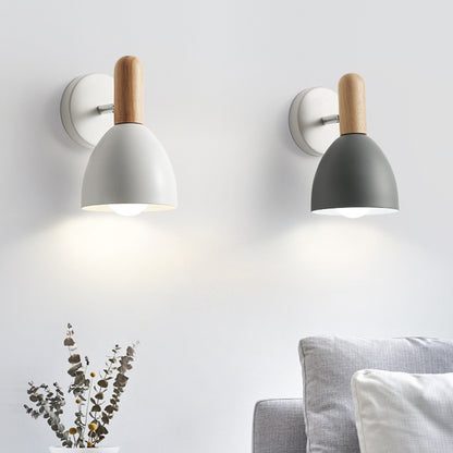 Two wall-mounted lamps with wooden accents on a light gray wall.