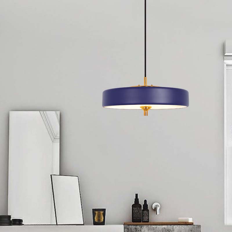 Blue Minimalist LED Pendant Lamp with brass accents installed in a bright modern interior.