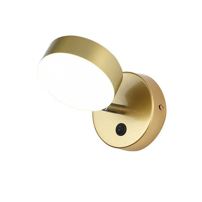 Gold wall-mounted light fixture on a white background