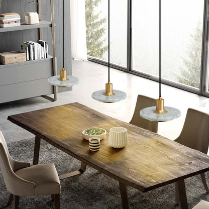 Modern Marble Pendant Light in a dining room with a wooden table and chairs.