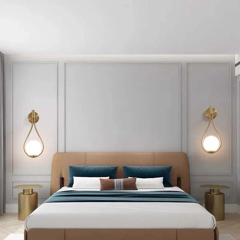 Modern sconces on both sides of the bed above the nightstands