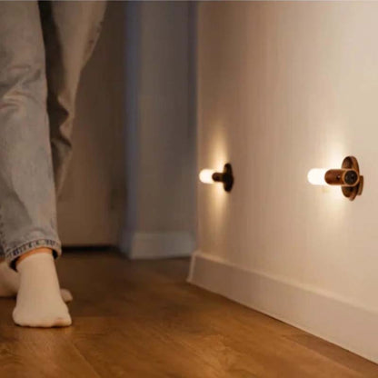Motion sensor wireless LED wall light for hallway, providing safe nighttime pathway lighting with automatic on/off