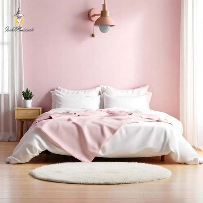 Nordic Style Wall Sconce in a bedroom with pink walls, white bedding and a small wooden nightstand.