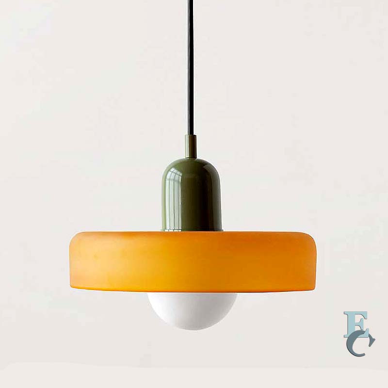 Pendant light with orange shade and green fixture on a white background