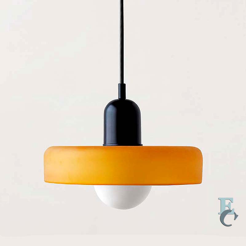 Pendant light with orange shade and black fixture on a white background