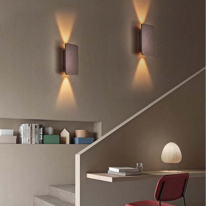 Modern wall lights on a staircase with a minimalistic interior design.
