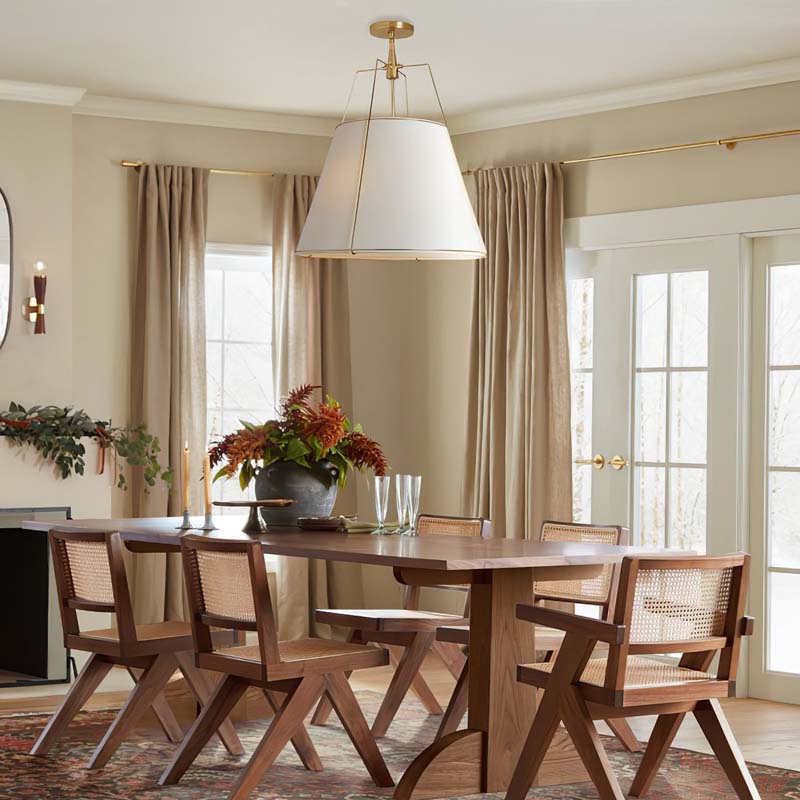 Pendant Lampshade Comfort in a dining room with a wooden table and chairs, large window and decorative elements.