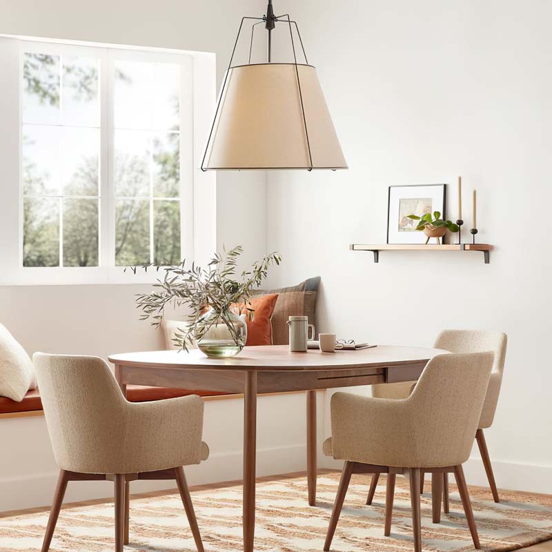 Pendant Lampshade Comfort in a modern dining room with a wooden table and chairs and a window view.