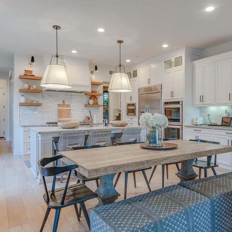 Pendant Lampshade Comfort in a modern kitchen with a wooden dining table and chairs.