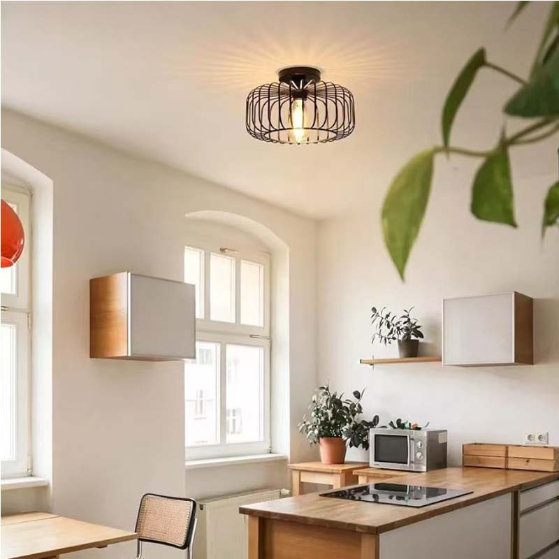 Pendant light with metal shade in a bright kitchen