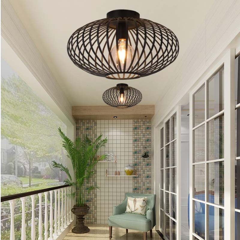 Pendant lights with cage shade in a balcony interior