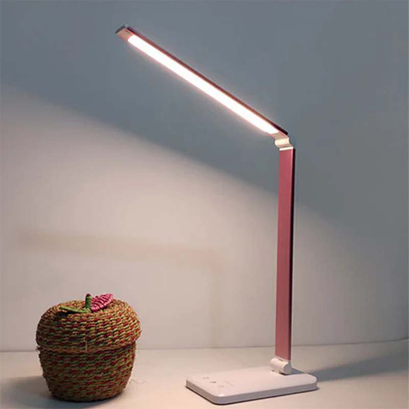 Modern LED desk lamp on a neutral background