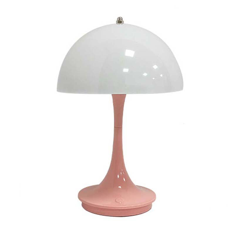 Pink table lamp with a white dome-shaped shade on a white background