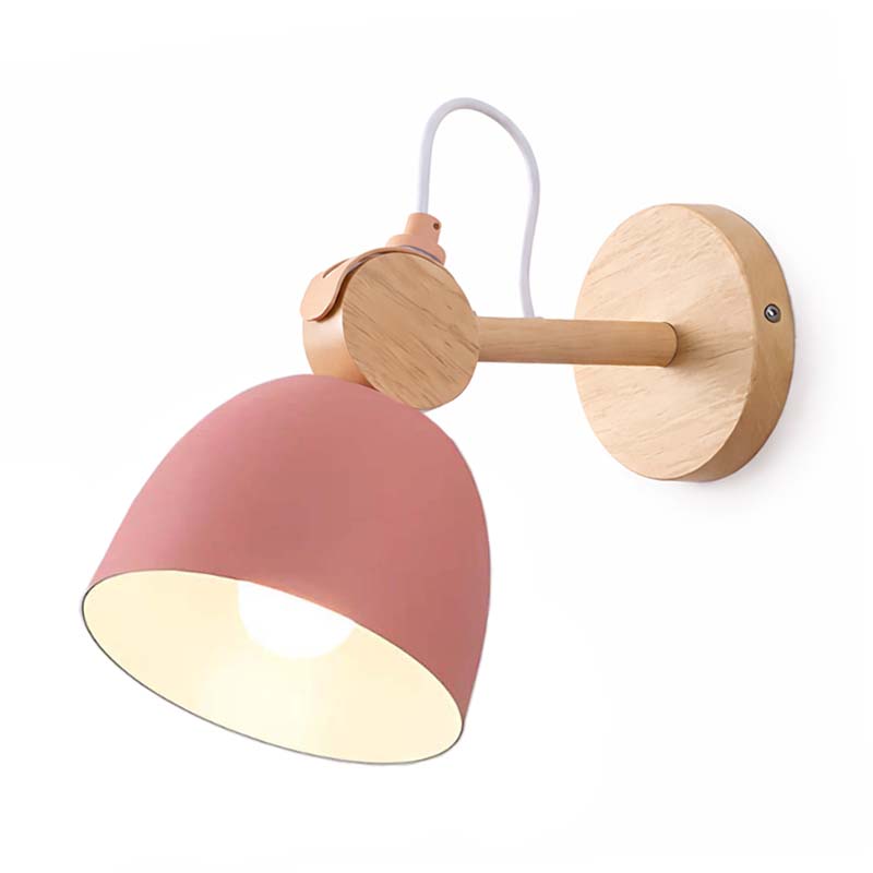 Wall-mounted lamp with pink shade and wooden fixture on a white background