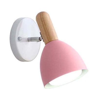 Wall lamp with pink shade and wooden handle on a white background