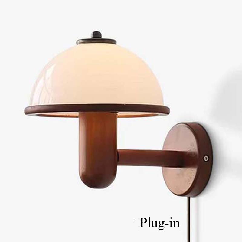 Wall-mounted lamp with wooden base and white shade on a white background