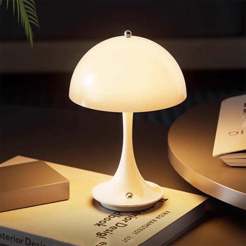 White table lamp on a book with a dark background
