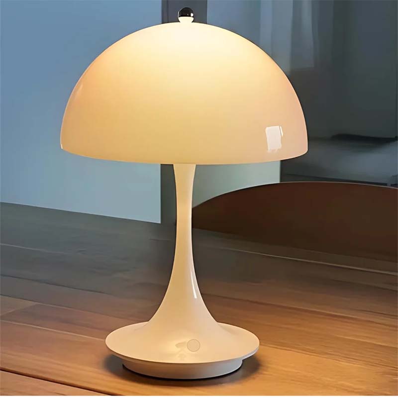 White table lamp on a wooden surface with a blurred background