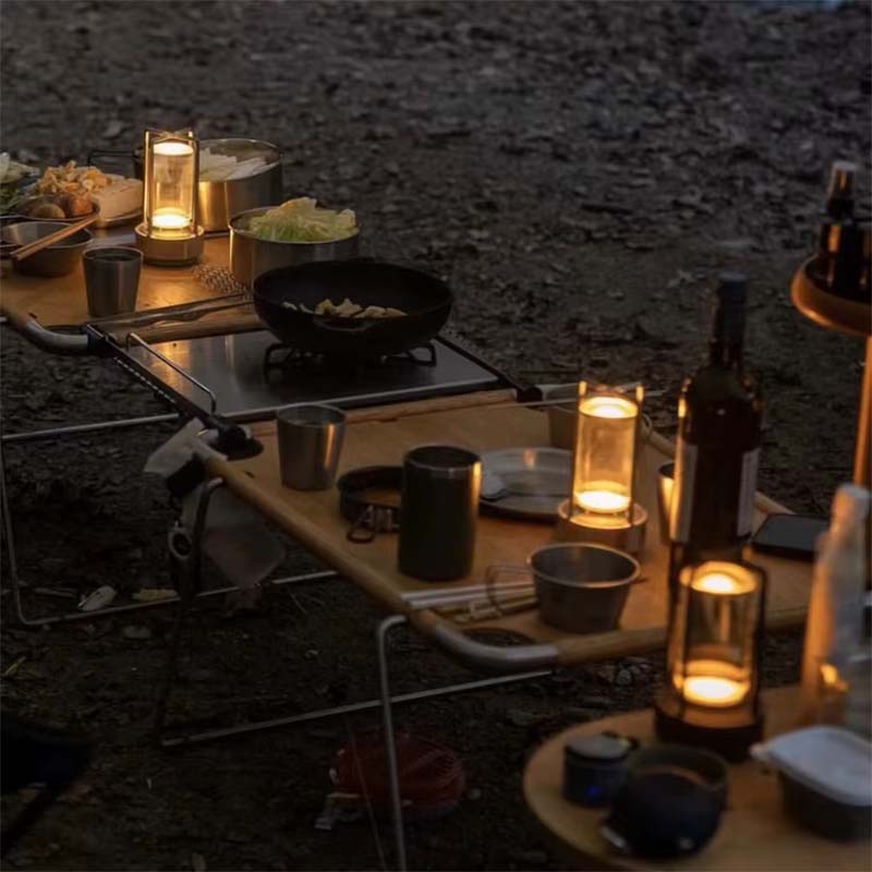Portable Touch LED Lamp Crystal on Wooden Camping Table: Kitchen Equipment and Food.