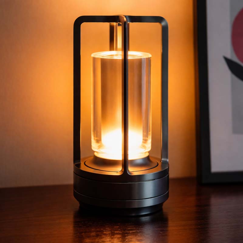 Modern candle lantern with glass cover on a wooden surface