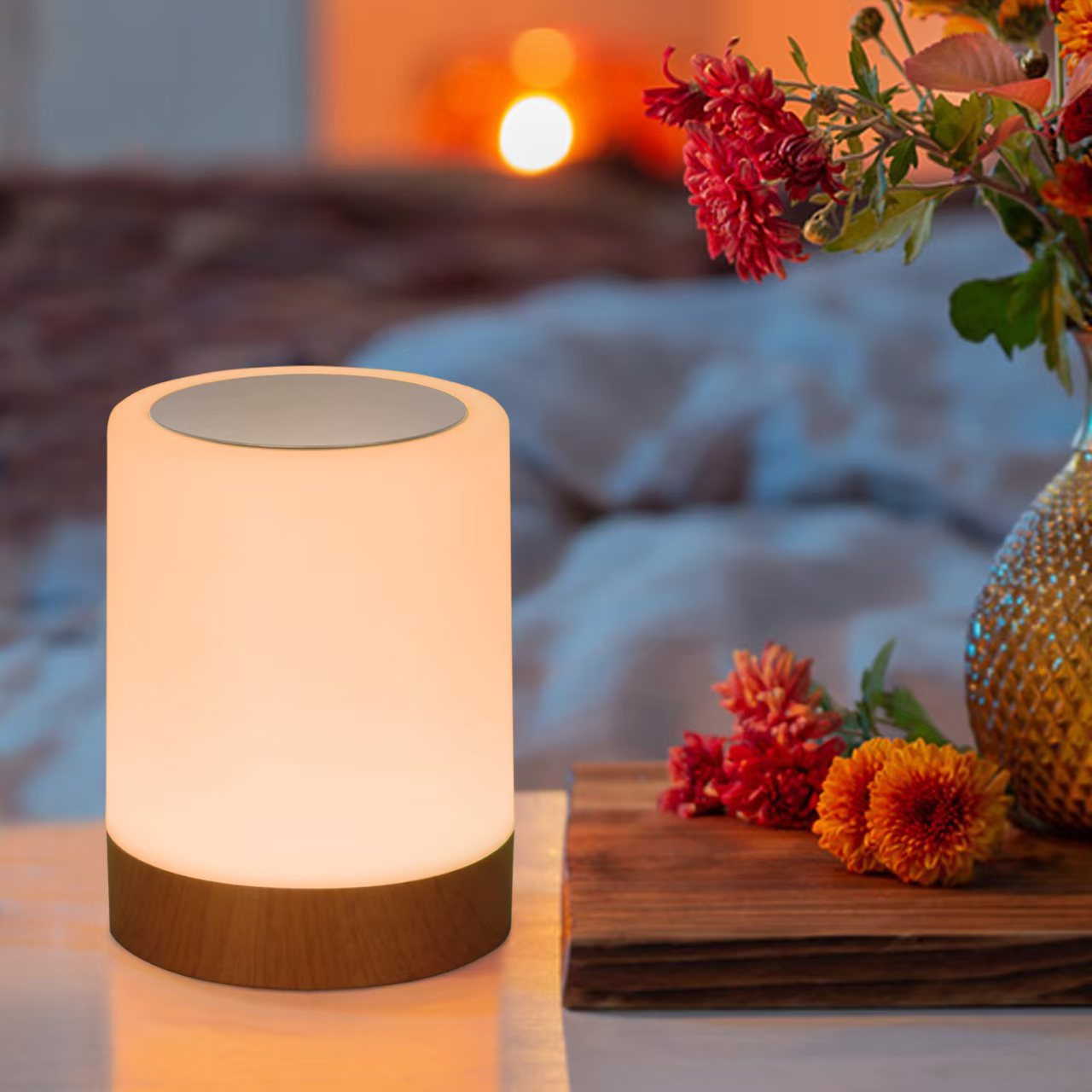 Table lamp with wooden base and floral decorations on a table