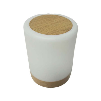 White cylindrical lamp with wooden top and bottom on a white background