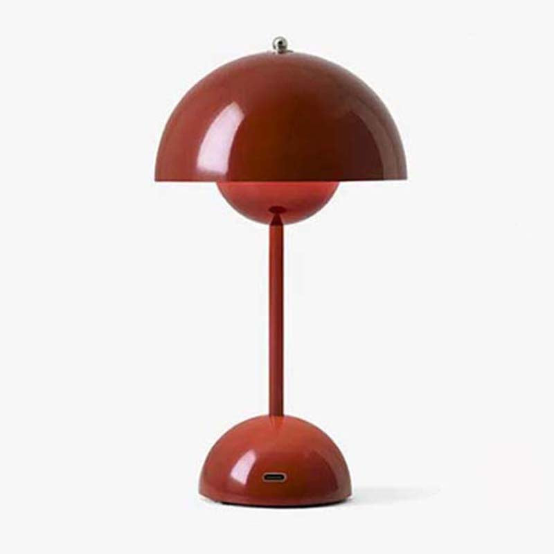 Red table lamp with a unique design on a white background
