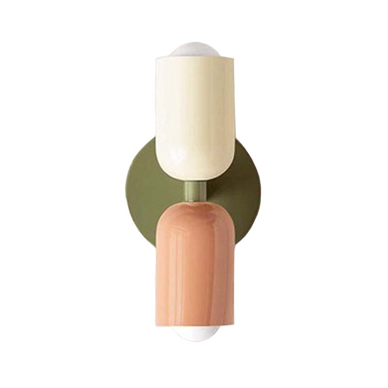 Wall-mounted light fixture with a green and pink design on a white background
