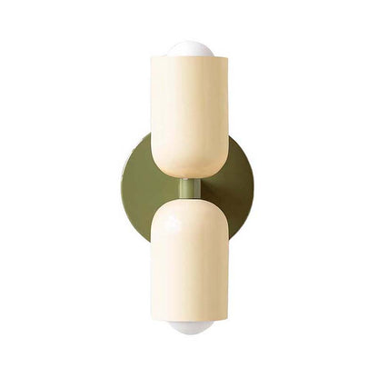 Wall-mounted light fixture with beige cylindrical shades on a white background