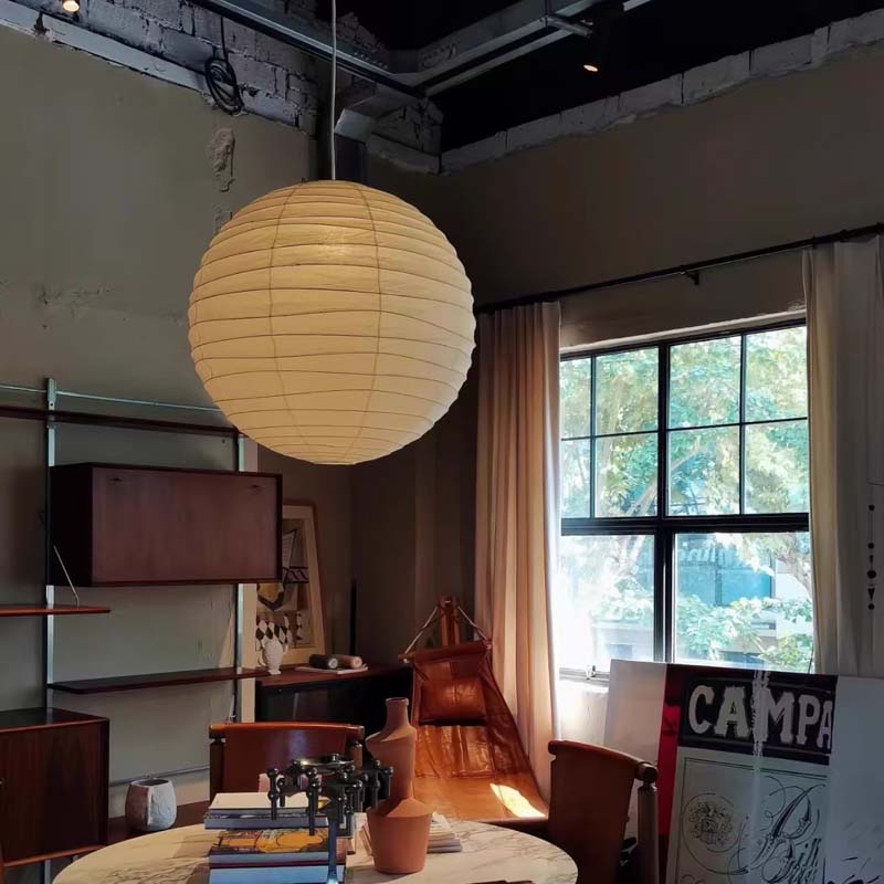 Round paper pendant lamp in a cozy studio.