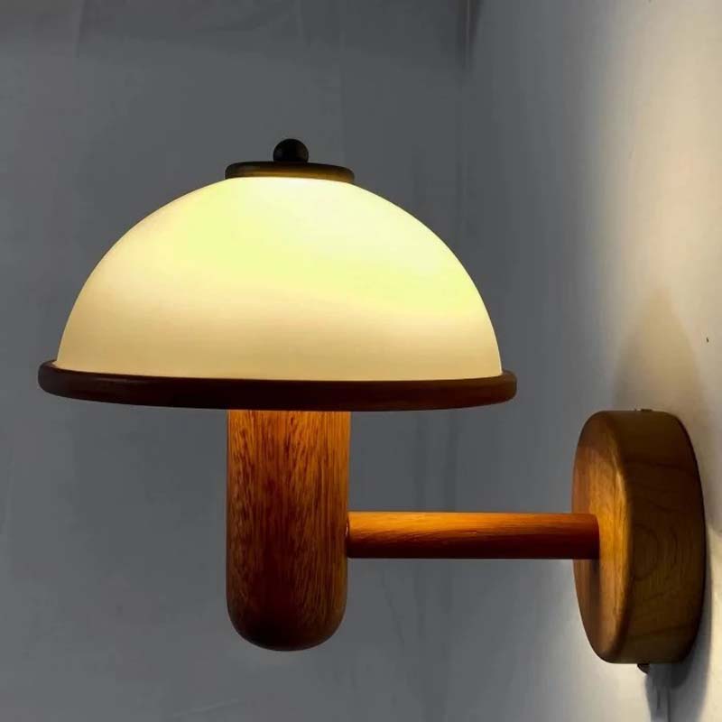 Wooden wall lamp with a white glass shade on a plain background