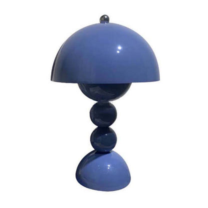Blue table lamp with a unique design on a white background