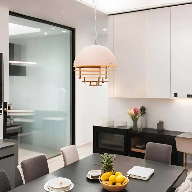 Sunset pendant lamp in a modern kitchen-dining area with contrasting furniture.