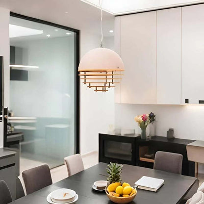 Sunset pendant lamp in a modern kitchen-dining area with contrasting furniture.