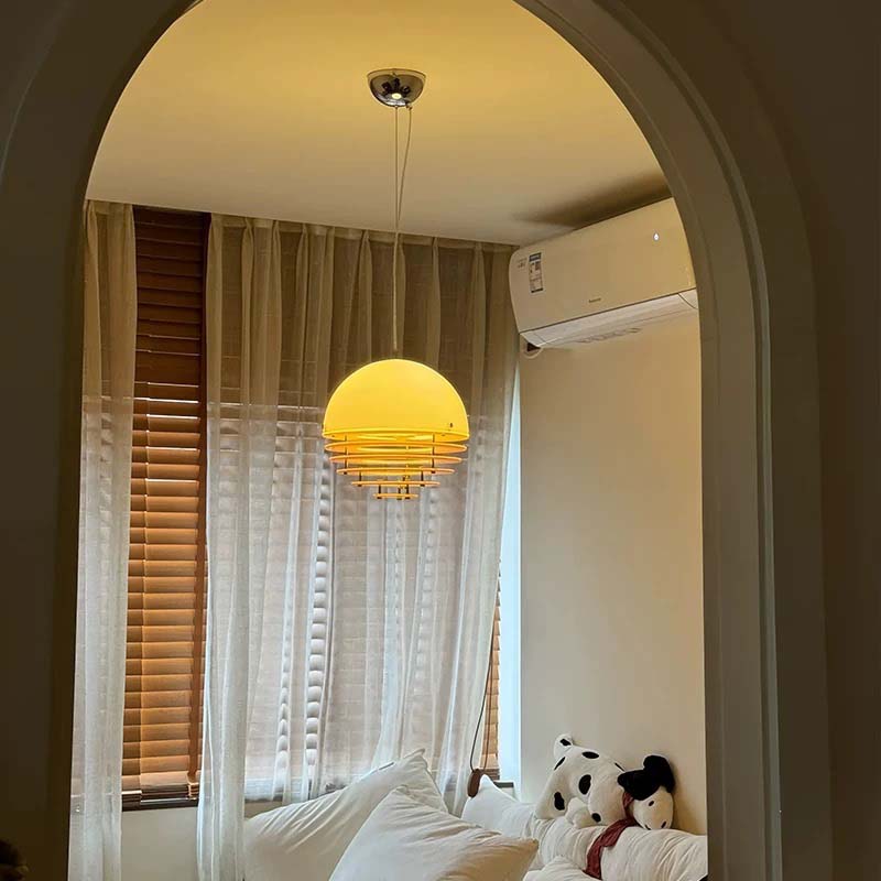 Sunset pendant light with soft glow near a window