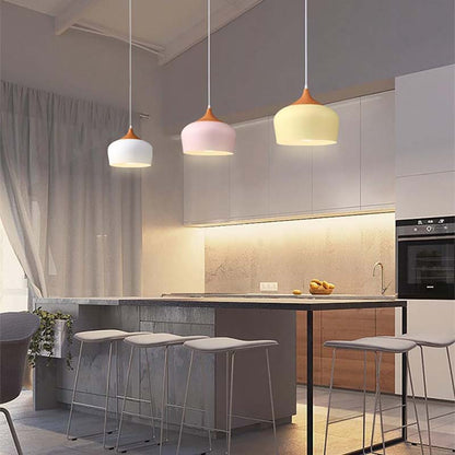 Modern kitchen with pendant lights and bar stools