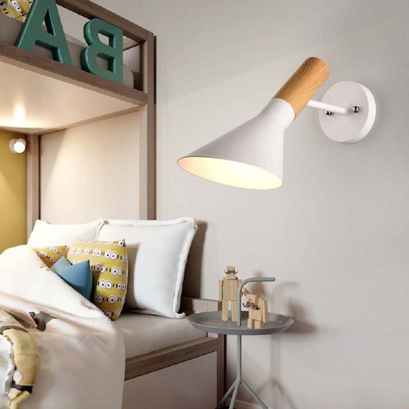 Wall-mounted lamp with wooden accent in a bedroom setting