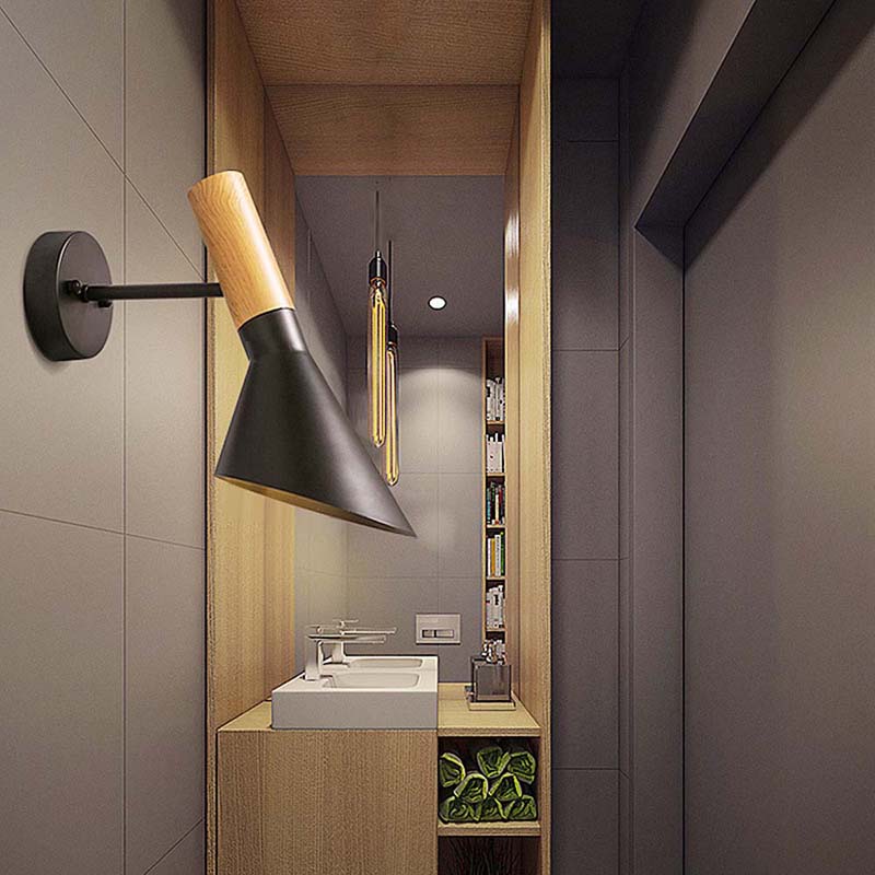 Modern bathroom interior with a wall-mounted lamp and sink.