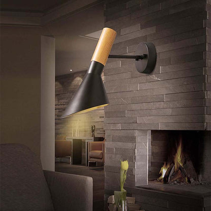 Modern wall-mounted lamp with black and wood design in a cozy living room setting.