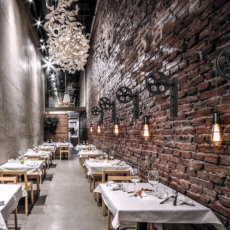 Modern restaurant interior with a brick wall and wall sconces