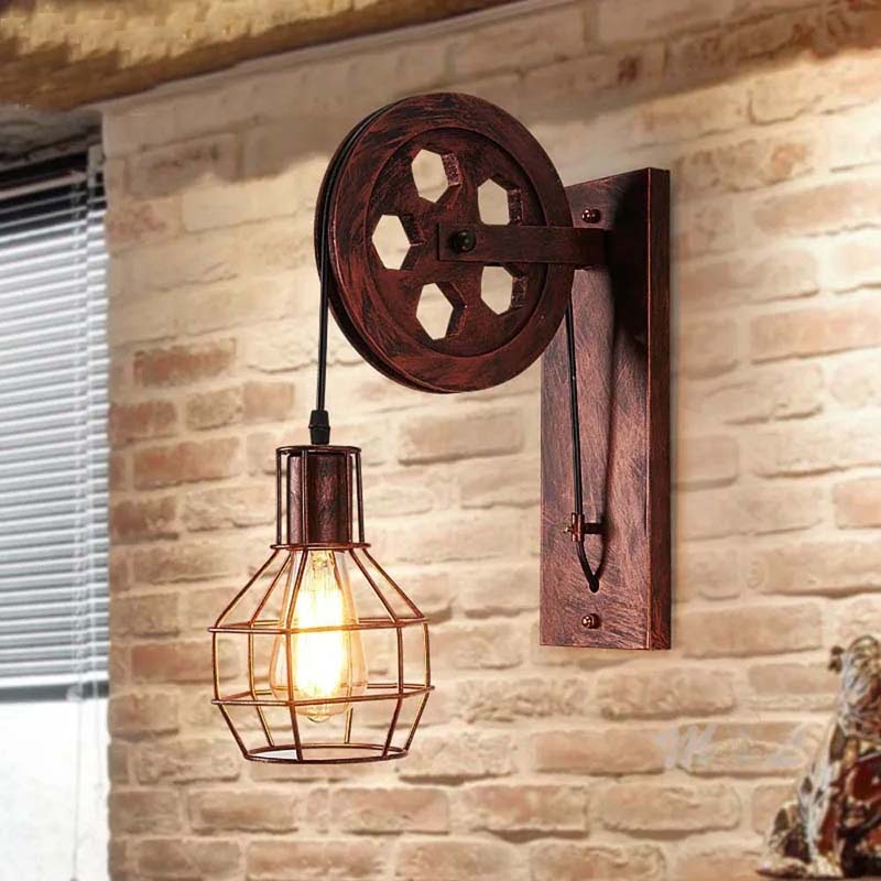 Industrial-style wall lamp with wooden pulley design on a brick wall.