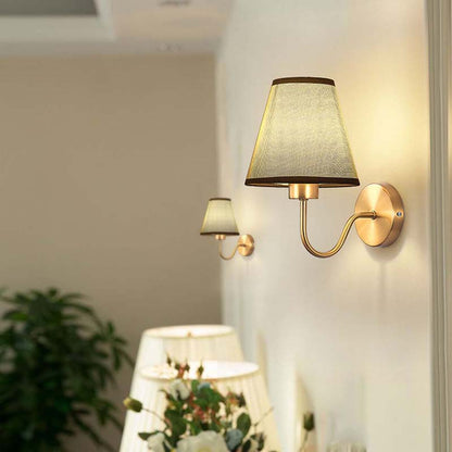 Wall-mounted lamp with a fabric shade in a home setting